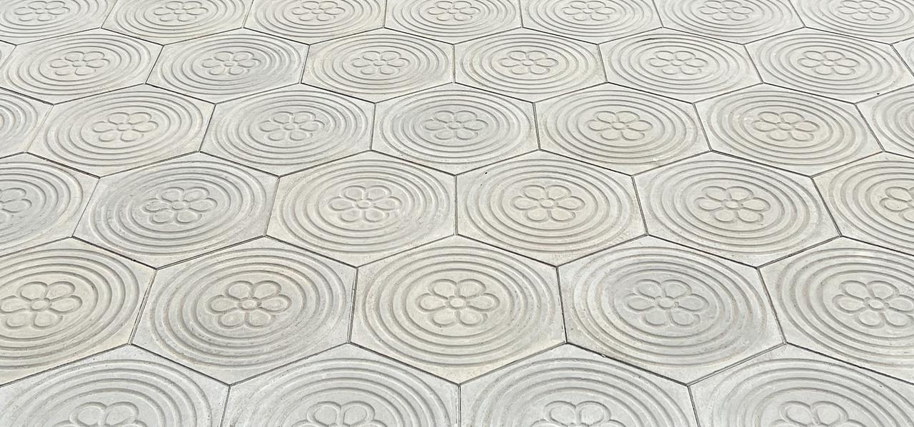 Exterior concrete pavement slab hexagonal with flower motif and circles 