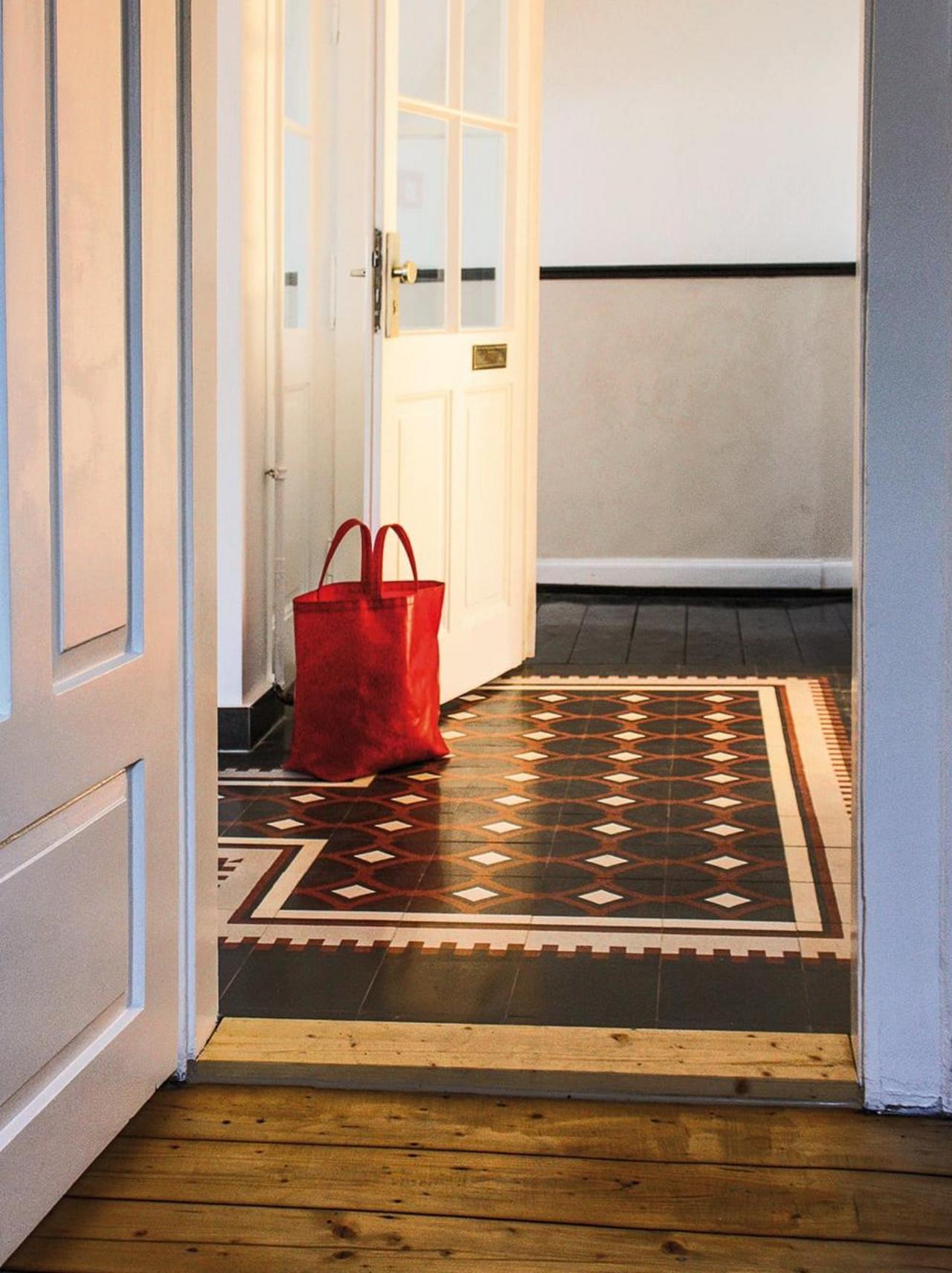 VIA terrazzo tiles in the old building in the hallway with wooden floorboards 