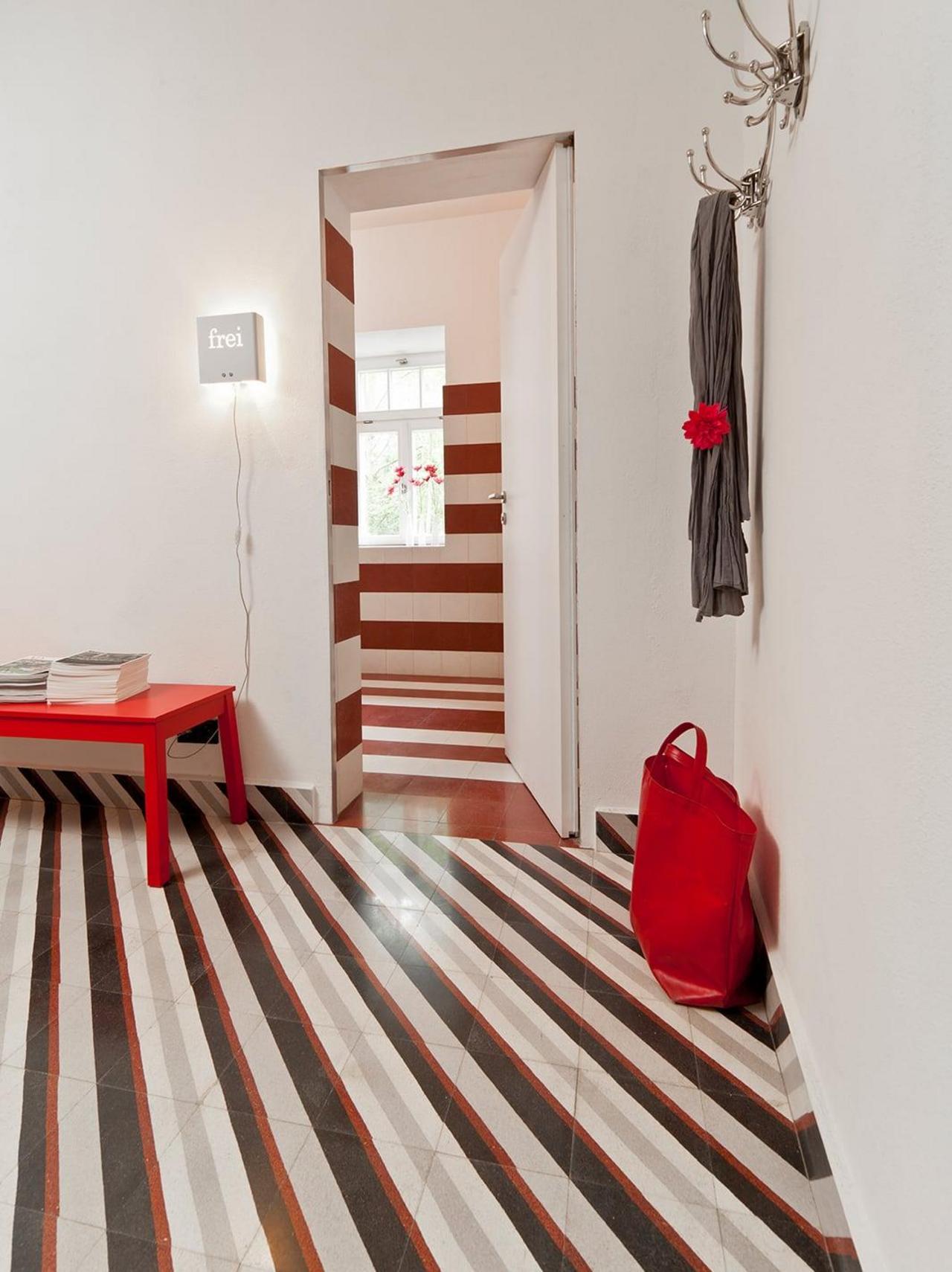 Entrance with diagonally laid terrazzo tiles from VIA 